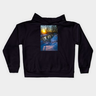 Snow falling on a river with snowy banks Kids Hoodie